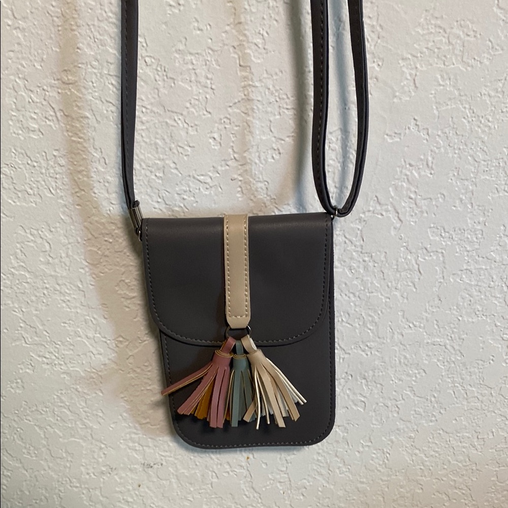 Elegant Black Crossbody Bag with Tassel Accents